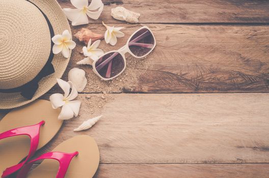 Travel accessories for summer on wooden background