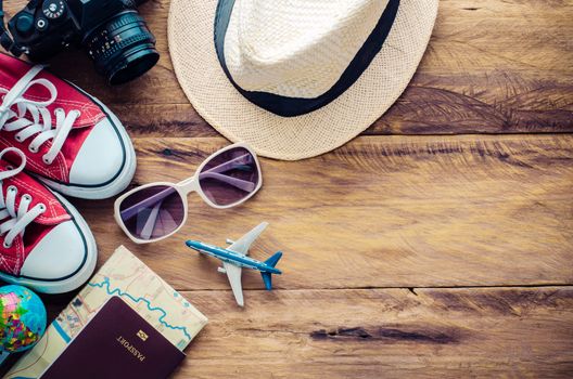 Travel accessories and costume on wooden floor