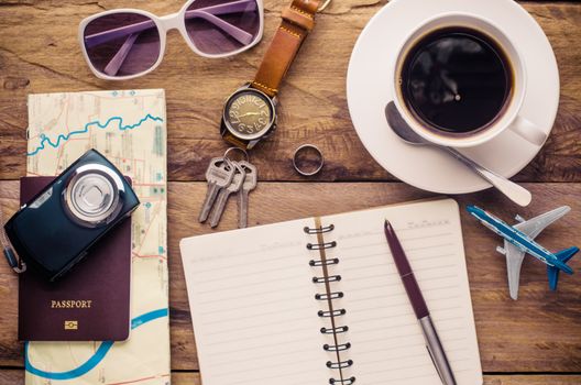 Planning for trip clothing and accessories on wood floor