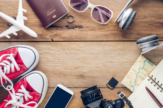 Tourism planning and equipment needed for the trip on wooden floor