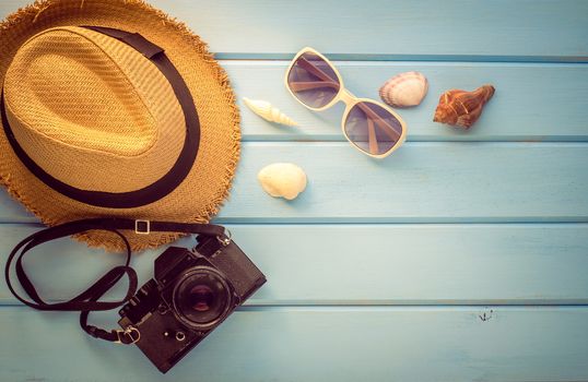 Accessories costume for summer on blue wooden floor