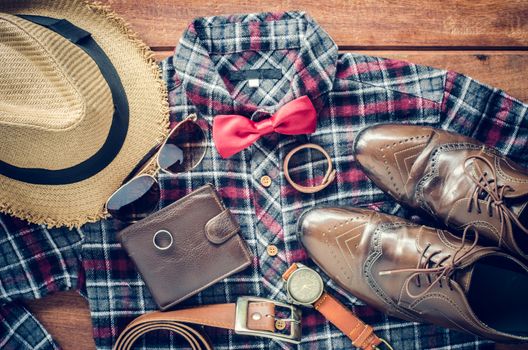 Accessories and apparel for men on a wooden floor - life style