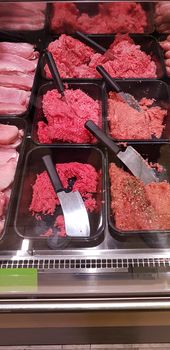 Variety of meat products in butcher shop