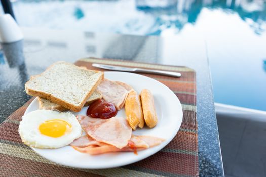 Delicious Breakfast set by the swimming pool at Pattaya, Thailand