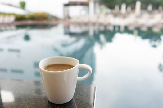 Latte Coffee in the breakfast set by the swimming pool