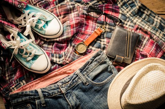 costume and accessories for men, placed on a wooden floor.