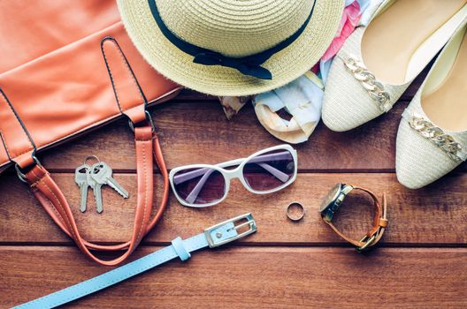 Travel Clothing accessories apparel along for women on wood