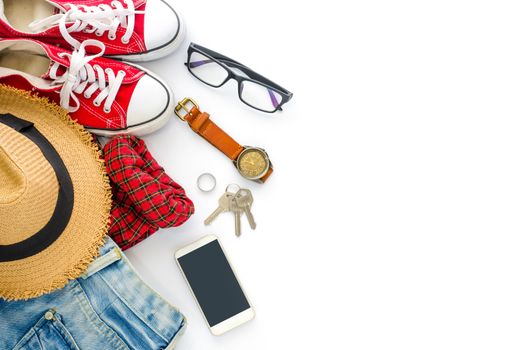 Travel accessories and costume on white background