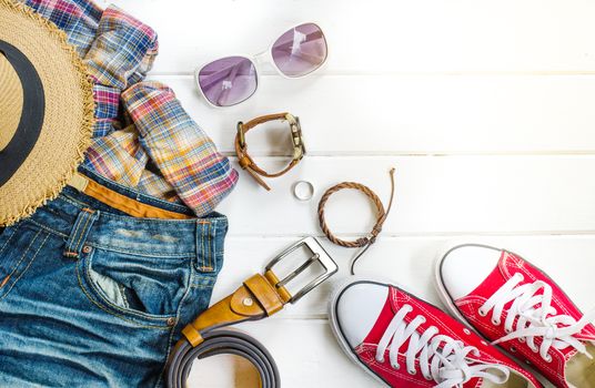 Travel accessories and costume on white background