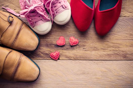 shoes, three pairs of dad, mom, daughter - the family concept