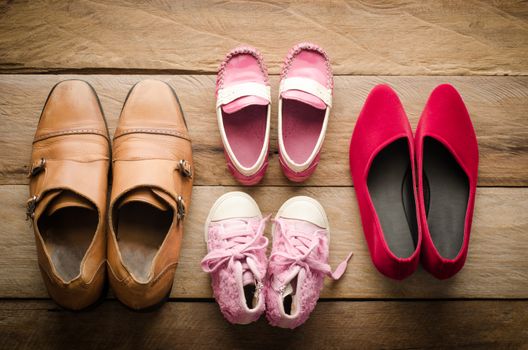 shoes, four pairs of dad, mom, daughter and son - the family concept