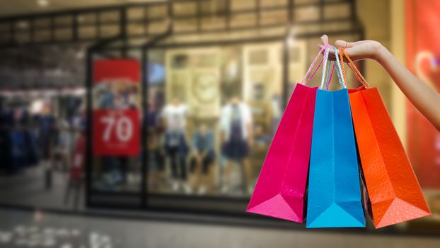 Woman with shopping bags in shopping mall