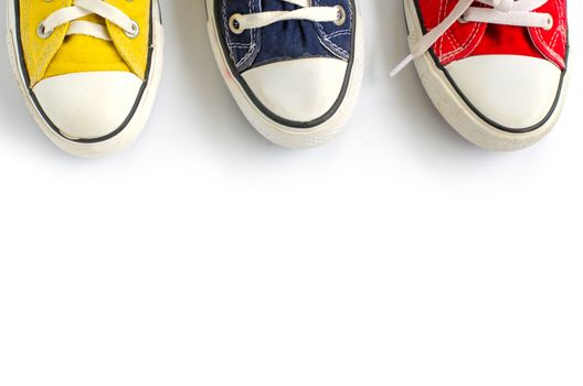 Multicolored sneakers on white background