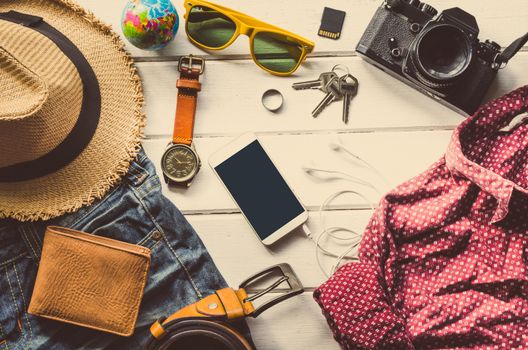 Travel Clothing accessories Apparel along for the trip on white wood floor