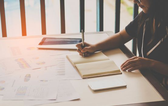 business woman analysis with financial graph at office, workplace,work  times.