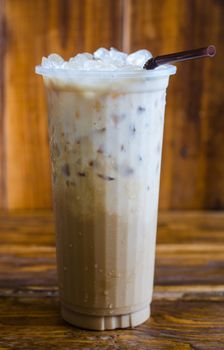 Iced coffee on wood background