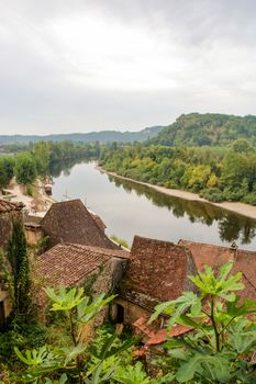  The picturesque village of La Roque Gageac reflecting in Dordogne river