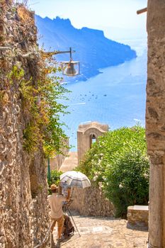 At Ravello - Italy - On august 2018 - A painter reproducing a lovely view of Ravello in Via dell'Annunziata 