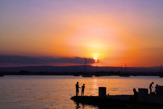 The harbor of Siracusa at sunset
