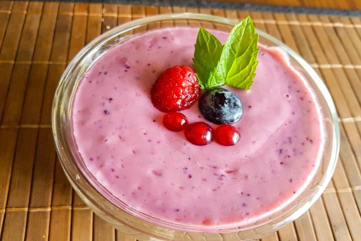 Low calorie food. Fresh healthy blueberries raspberries and redcurrants smoothie