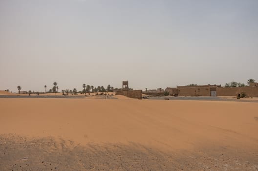 Merzouga village near sahara Erg Chebbi  dune in sand storm. Morocco