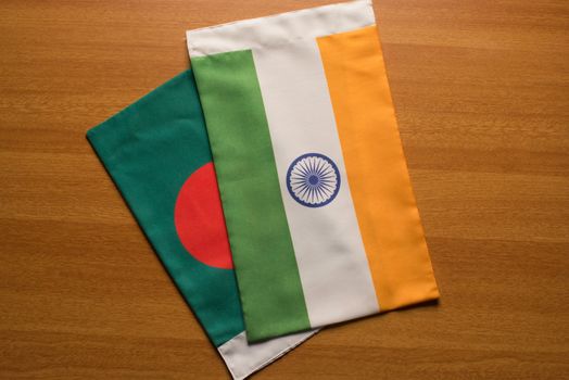 Bangladesh and Indian flags placed on table