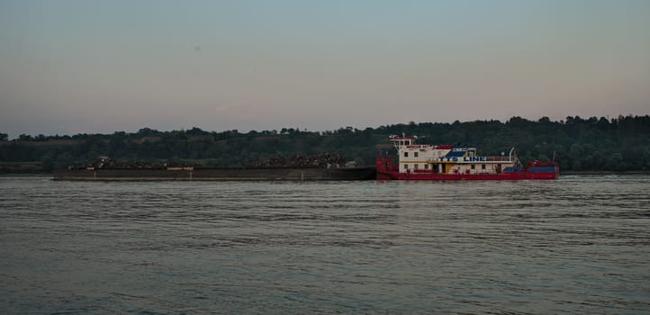 NOVI SAD, SERBIA - August 12th: Cargo ship slowly flowing on Danube