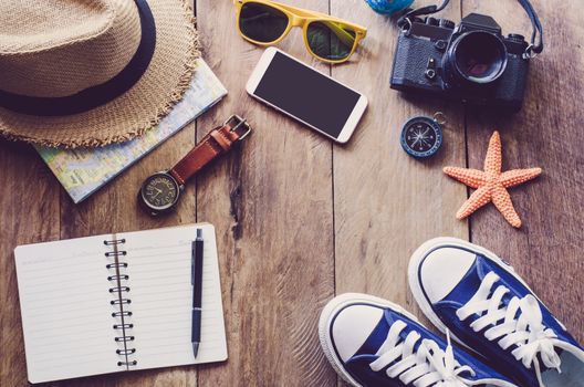 Travel Clothing accessories Apparel along on wooden floor 