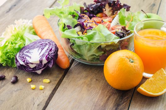 vegetable salad bowl and fruit juice - healthy eating concept