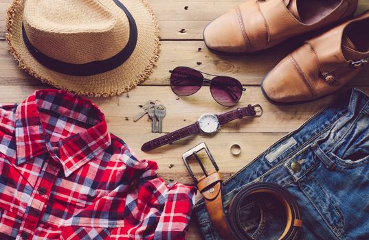 Travel Clothing accessories Apparel along on wooden floor 