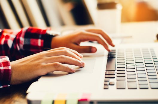 Business woman working at office with laptop
