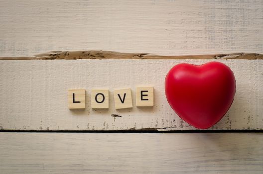 Valentines Day background with hearts and the word love.