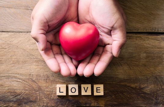 hands men giving red heart and word for love