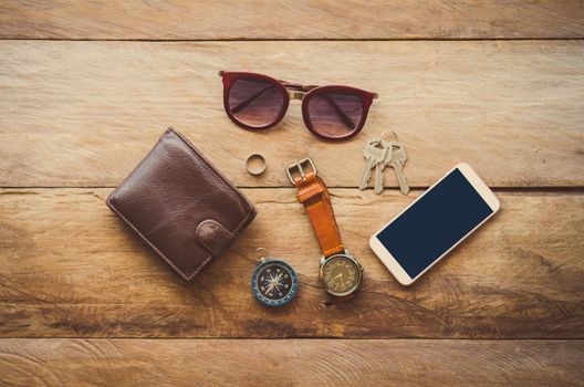 Accessories for men on the wooden floor.