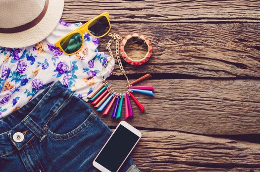 Travel Clothing accessories Apparel along on wooden floor 