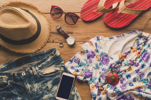 Travel Clothing accessories Apparel along on wooden floor 