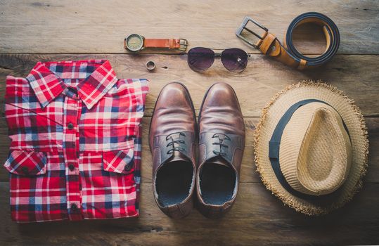 Travel Clothing accessories Apparel along on wooden floor 