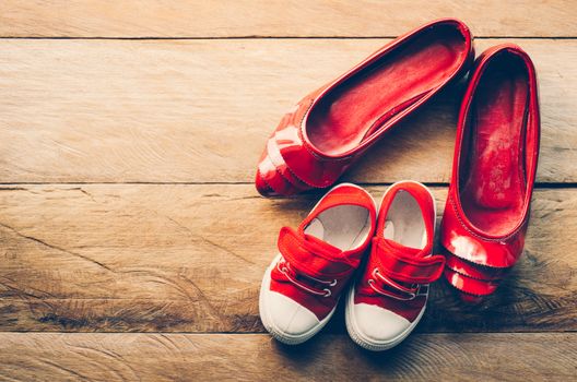 The shoes of mother and baby - concept take care