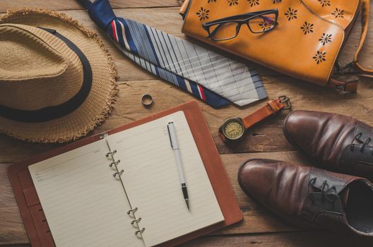 Tourism planning and equipment needed for the trip on wooden floor 