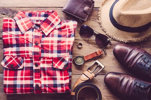 Travel Clothing accessories Apparel along on wooden floor 