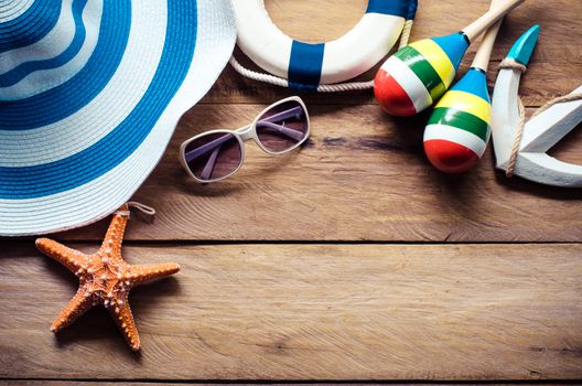 Accessories costume travel for summer on wooden floor.