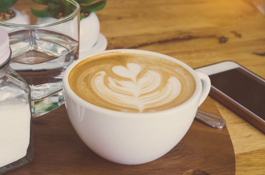 coffee latte cup on a wood table