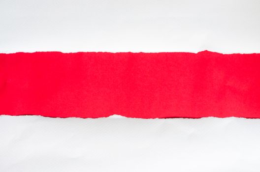 The paper is torn on a red background and there is a cutoff to the free space for your text. 