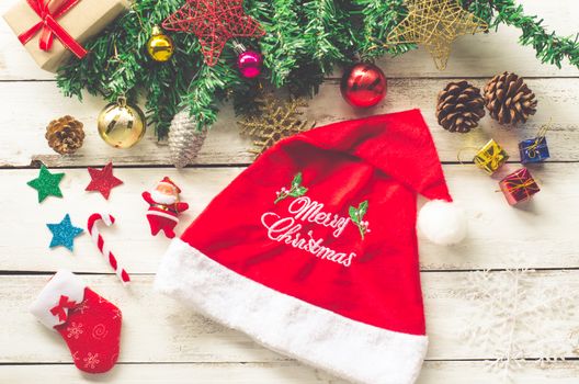Christmas decorations and "Merry christmas" greetings on a wood white background.
