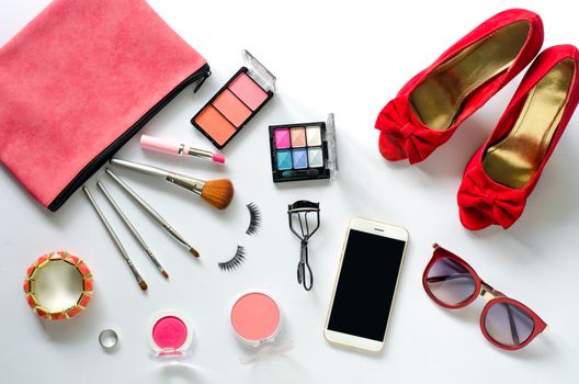 Set of decorative cosmetics and accessories for women on white background