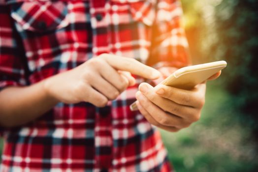 Man using smartphone for data connection and search to data