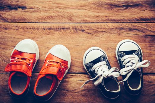 Shoes for children on wooden floor - lifestyle