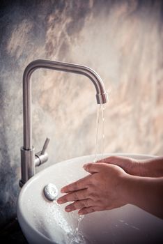 Washing hands in the sink