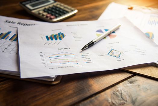 Document Book Pen Graph Calculator And accounting documents placed on the desk in office