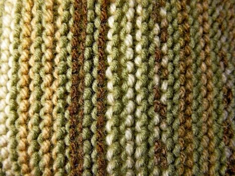 Knitted fabric texture. Background image. Hobbies, leisure, crafts. Vertical arrangement of the pattern